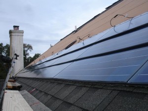 Three rows of solar panels on the roof