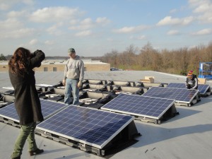Solar panels get placed on racks