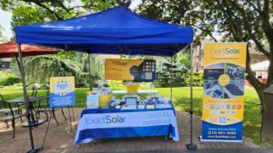 Table and tent with Exact Solar logo