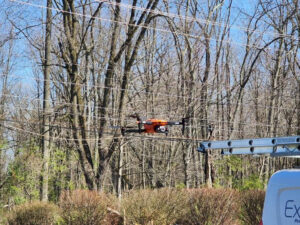 A drone flies through the air as it surveys a local home.