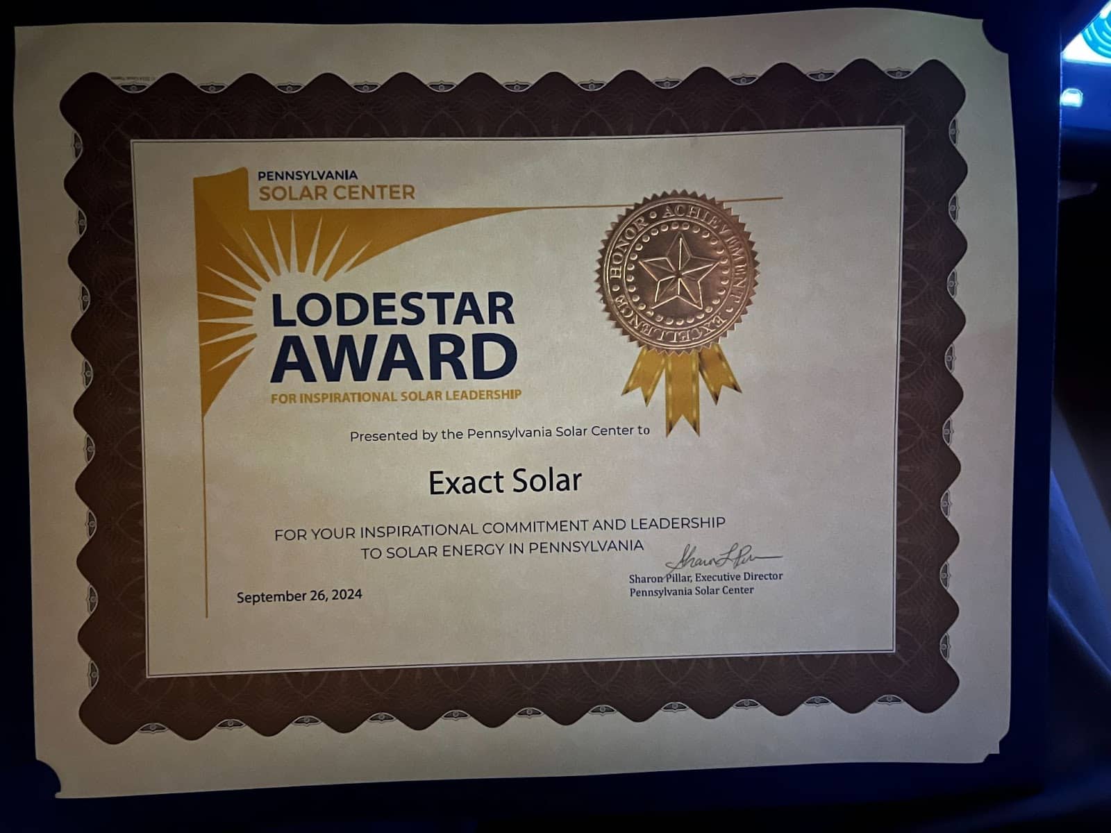 Lodestar Award certificate presented to Exact Solar