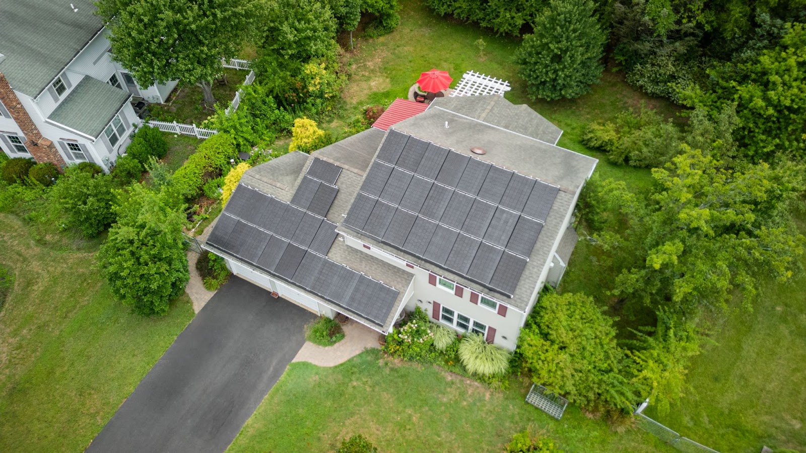 An aerial photo of a house with a rooftop solar system