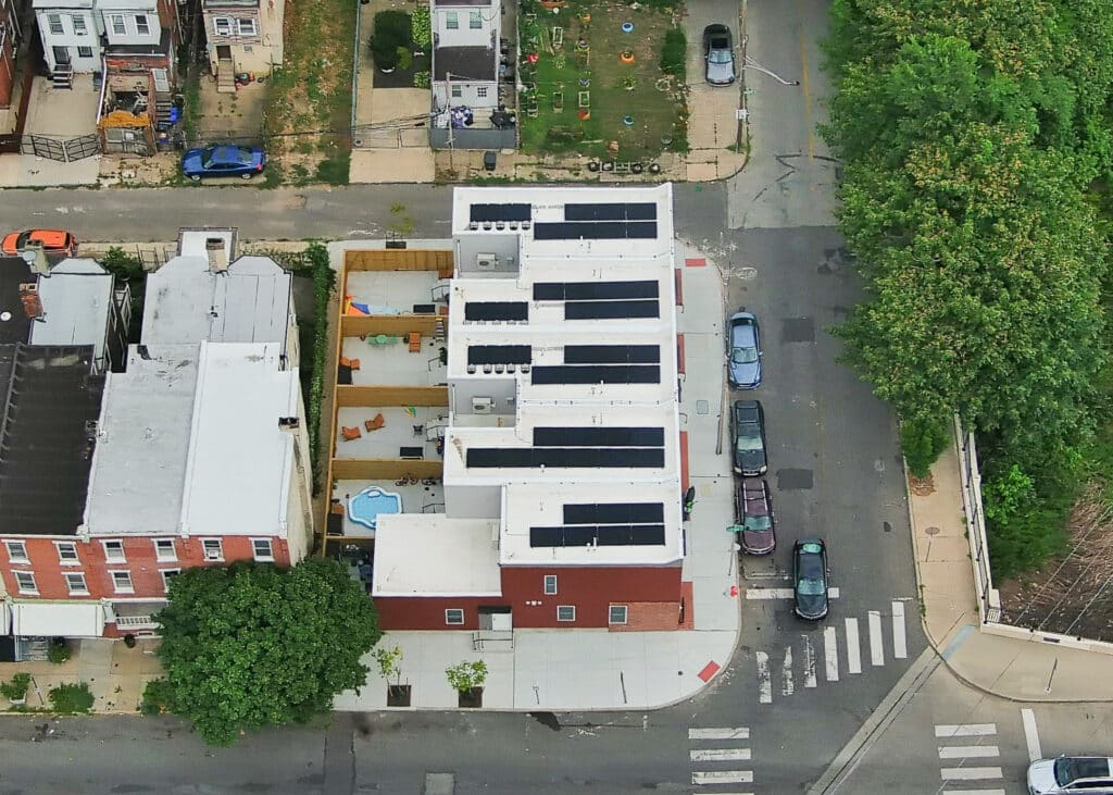 An aerial view of solar panels on the roof of the Coltrane Commons development in Philadelphia's Strawberry Mansion.