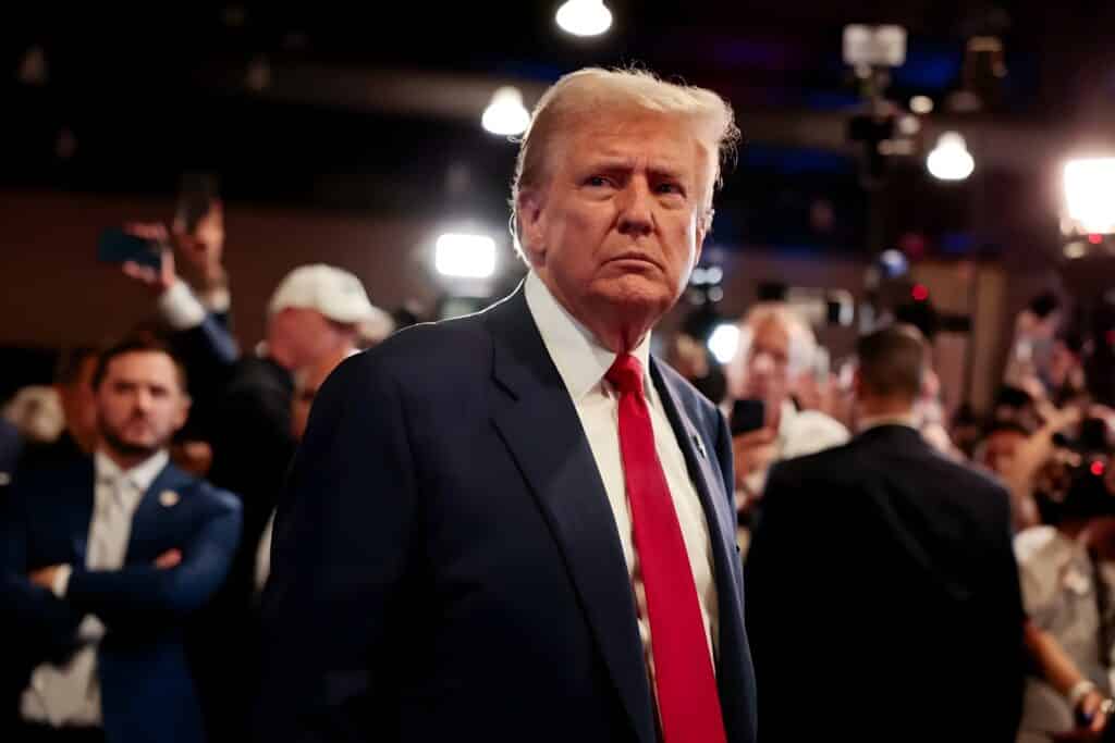 President Trump standing in front of a crowd at an event