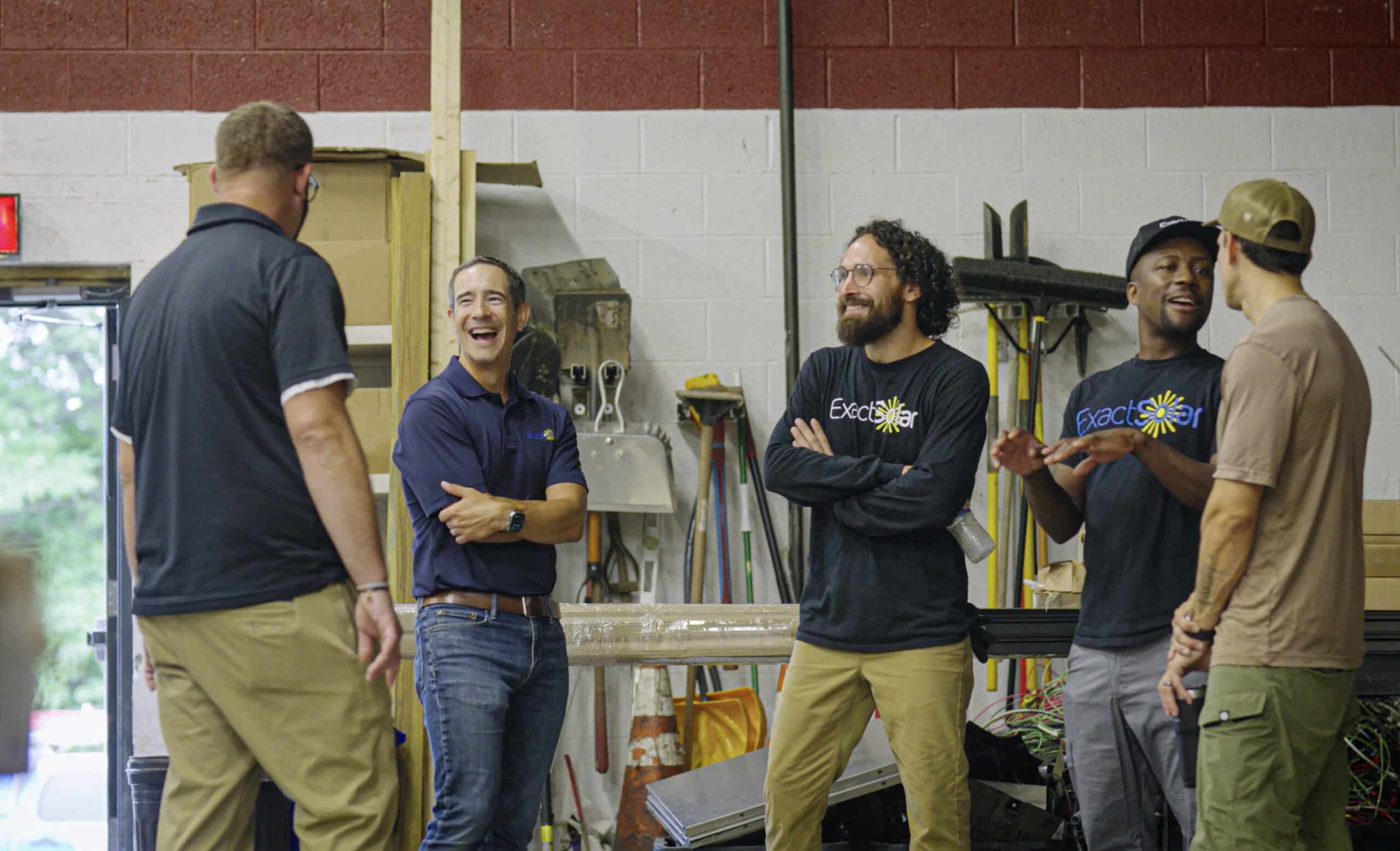 Doug Edwards pictured with a few Exact Solar team members.