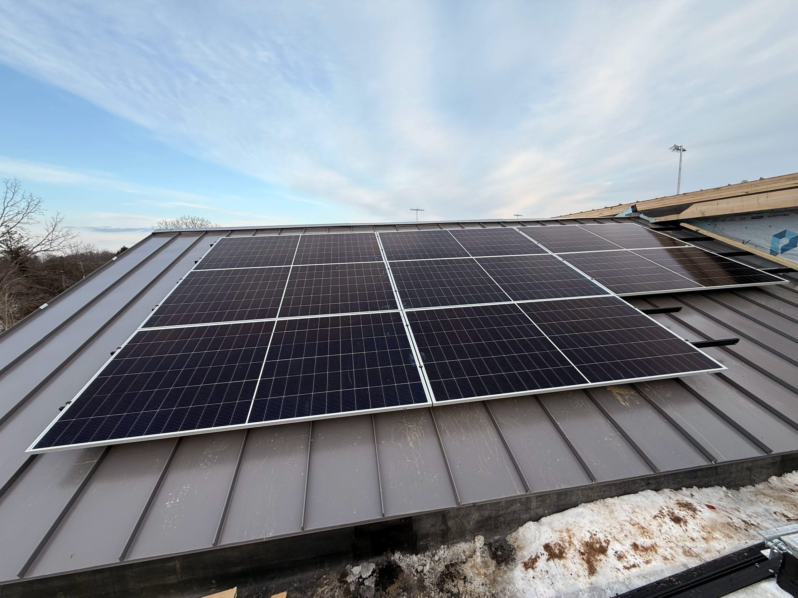 The 103-panel array uses the field house roof to generate electricity for district operations.